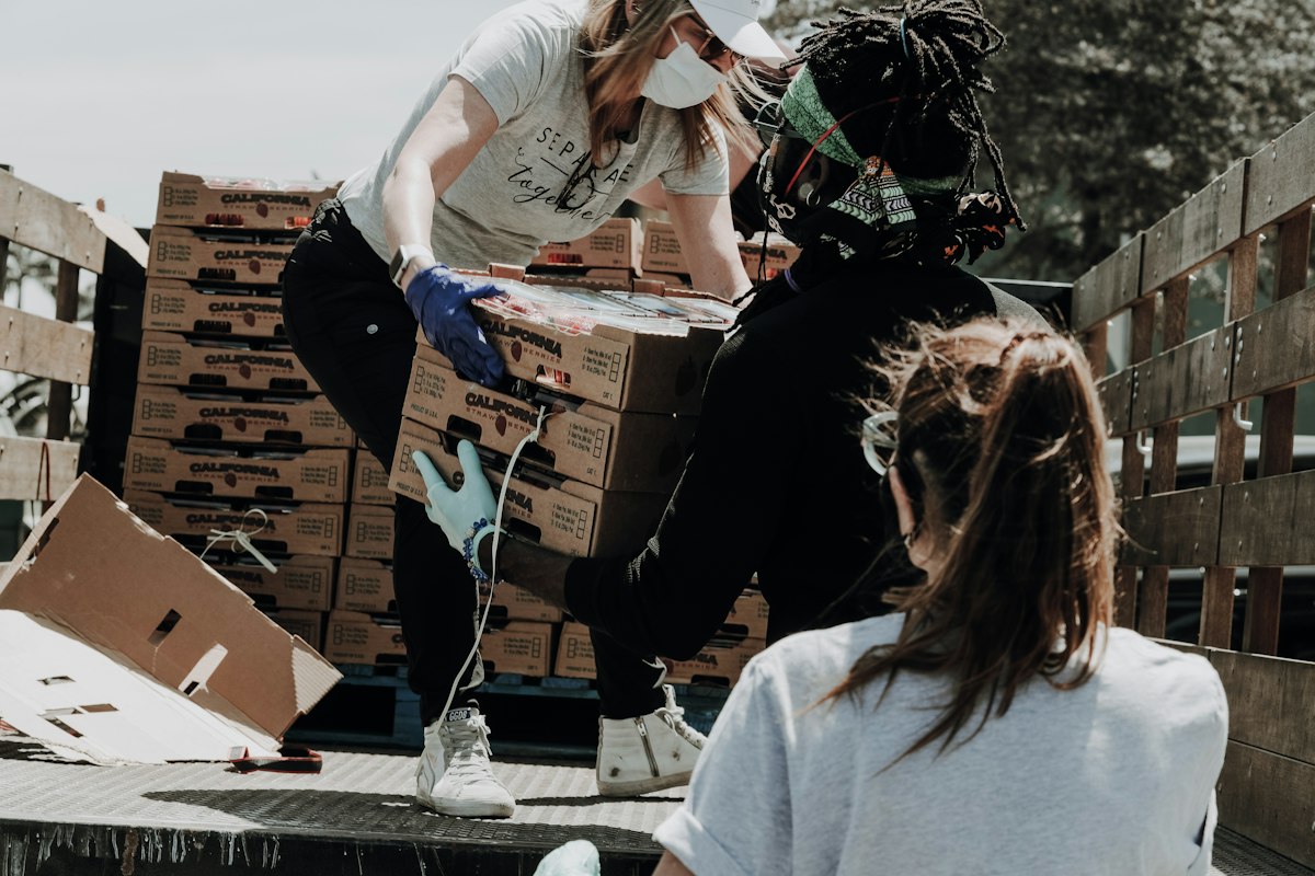 Volunteers packing food and health kits